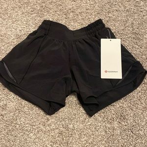 Lululemon black hotty hot LR short 4” lined, size 0, never worn.